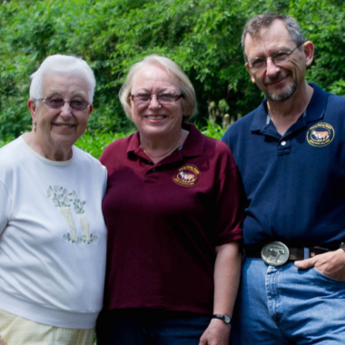 Group of older adults smiling.