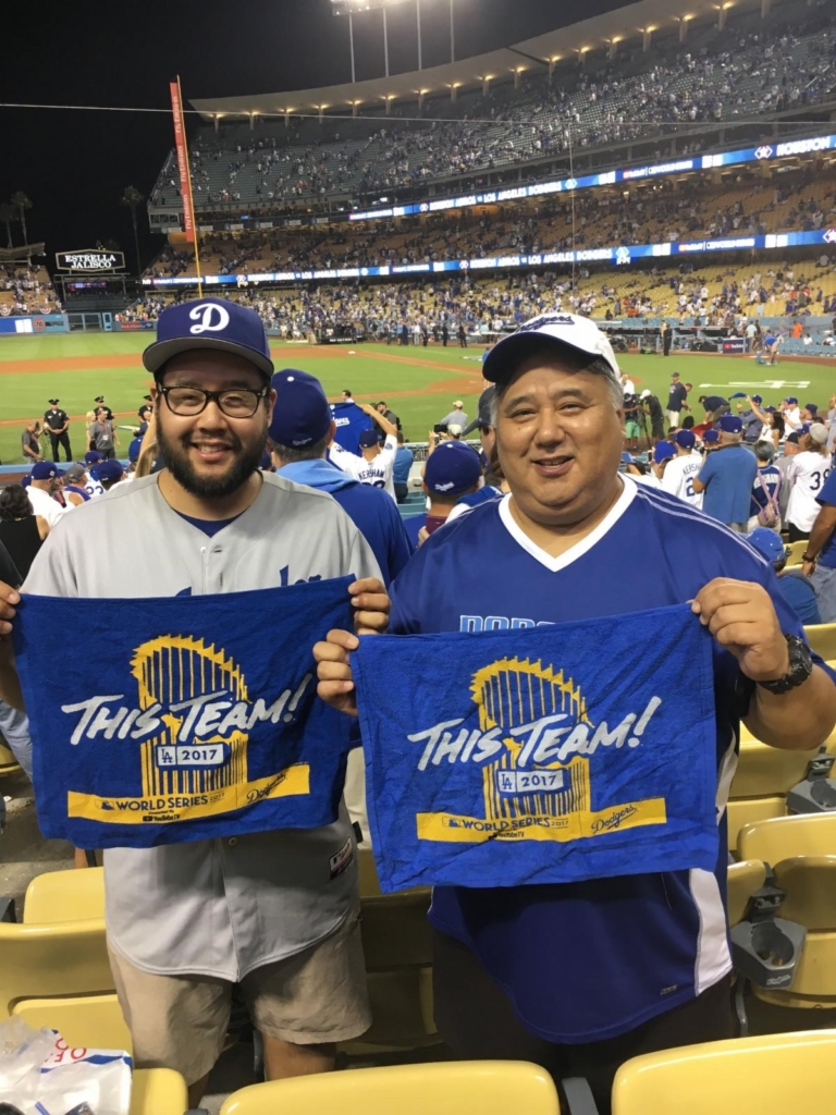 Craig and his father at a baseball game.