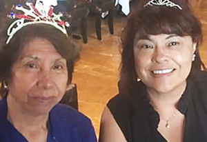 Two Hispanic women smiling. 