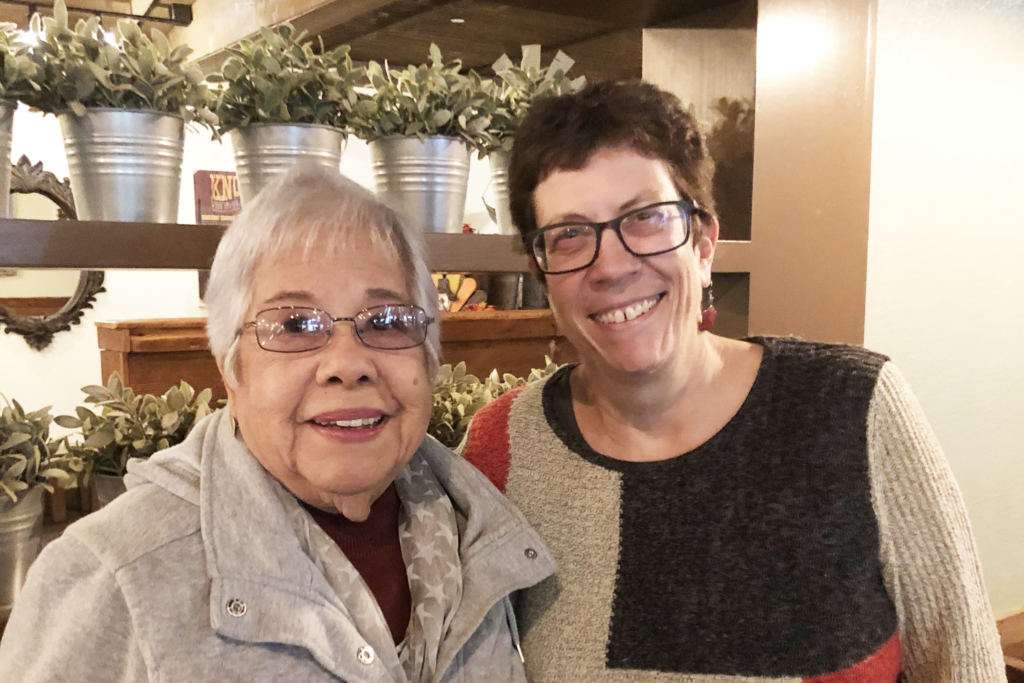 Two older women smiling