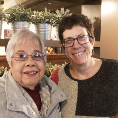 Two older women smiling