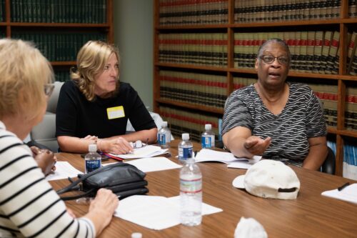 Women at a table at the listening session in Pittsburgh, PA for ICC